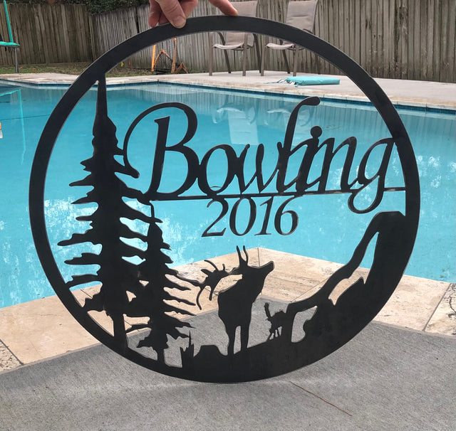 metal sign with elk silhouette by pool 