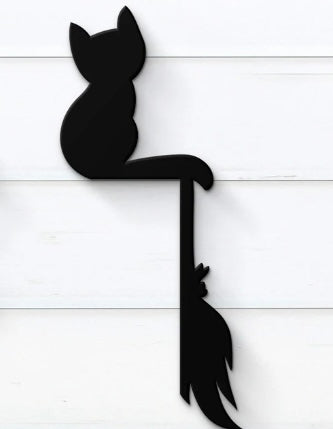 cat and broom door frame sign